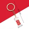 Saludos de Año Nuevo 2025 Palabras Aceite Rojo Goteando Ping An Feliz Caqui Ruyi Rico Llavero Bolso Joyería