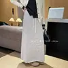 Saia de tricô listrada estilo francês com fenda traseira para mulheres, nova saia reta casual elegante versátil de cintura elástica para outono e inverno