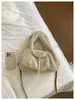 Bolso de mujer elegante de alta gama 2026 nuevo de moda versátil de felpa de mano de un solo hombro moda retro bolso cubo