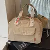 Nova bolsa de ombro curta vintage transfronteiriça para viagens de curta duração para mulheres, bolsa de mão leve de grande capacidade, bolsa para academia e para o dia a dia