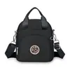 Bolso Pequeño de Lona para Mujer 2026 Verano Nuevo Estilo Mini Bolso de Hombro Casual Exquisito Multibolsillos Bolso Cruzado de Tela Oxford