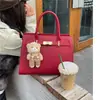 Bolsa de mão grande feminina transfronteiriça com toque de luxo para trabalho e dia a dia, novo modelo de primavera, simples e versátil, bolsa de ombro e transversal de grande capacidade