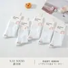Série Xin Shiyu Outono e Inverno Novo Estilo Meia de Algodão Espessa All-In-One de Cano Médio, Meias Lisas de Ponto Duplo Perfumadas, Modernas e Versáteis