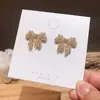 Pendientes elegantes de Dongdaemun coreanos con microincrustaciones de circonita y lazo, de plata S925, con exquisita aguja de diamantes, ideales para combinar con todo tipo de mujeres.