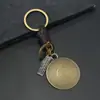 Chaveiros Criativos Populares Europeus e Americanos para Presentes de Homens e Mulheres Liga de Bronze Folha de Ginkgo Padrão do Zodíaco Couro Trançado Retrô Pingente