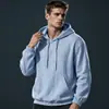 Nova blusa de moletom com capuz de algodão e linho estilo europeu e americano para homens, cor sólida, manga longa, top solto casual versátil