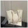 Bolsa de ombro única elegante, simples, versátil e da moda com blocos de cor para o trajeto de mulheres, novo modelo da primavera de 2026, bolsa tote de grande capacidade