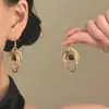 Pendientes únicos y hermosos para mujer, nueva colección 2026, estilo popular, con un lujoso color dorado y un diseño vintage con piedras de ojo de tigre en forma circular