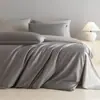 Conjunto de Roupa de Cama de Algodão de Fibra Longa Estilo Leve de Luxo dos Anos 60 Conjunto de Quatro Peças 100% Algodão Algodão Puro 2026 Novo Capa de Edredom Lençol de Cama Roupa de Cama