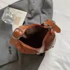 Bolsa Sela Vintage para Mulheres, Nova Bolsa Versátil em Forma de Meia-Lua Outono/Inverno 2026, Adequada para o Dia a Dia, Bolsa de Mão, Bolsa de Ombro, Bolsa Pequena Transversal