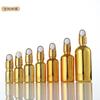 Venta al por mayor de fábrica cosméticos galvanizados embotellados 20ml botella de aceite de vidrio dorada botella con spray de presión botella cuentagotas