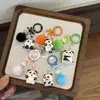 Encantador llavero de panda de resina 3D, animal de dibujos animados con lazo, dulce y adorable, perfecto como regalo para estudiantes o mejores amigos para colgar en sus mochilas