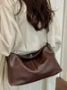 Nova bolsa de ombro lisa 2026, simples e estilosa, com um design único e moderno, alto apelo estético, adequada para o trabalho e uma bolsa de mão da moda para quem prefere um estilo mais discreto.