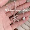 Joyería Coreana Dongdaemun Industria Pesada Plata Brillante S925 Plata Pura Collar de Moño Hueco Diseño Único Uso en Capas para Mujeres