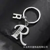 Llavero de estrella hueca con letra para comercio electrónico transfronterizo, llavero personalizado con letra nueva para hombre, accesorios