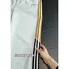 Pantalones de chándal a rayas estilo americano, nueva colección de otoño, corte holgado con caída, bordado color-blocking, versátiles para deportes y uso casual, largos, en blanco, gris y negro