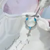 Nueva colección de serie de proteína azul de pendientes de acero de titanio médico, elegantes y versátiles, con diseños de trébol de cuatro hojas y cruz