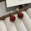 Pendientes Rojos de Cereza de Año Nuevo para Mujer 2026 Nuevo Estilo Caliente Pendientes Súper Bonitos Únicos Exquisitos con un Toque de Alta Gama