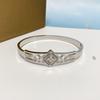 Pulsera de acero de titanio hueca por la letra diamante nicho simple Joker superventas