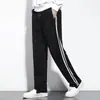 Pantalones de uniforme escolar estilo Hong Kong transfronterizos para niños y niñas, nuevos para primavera y otoño, azul marino, deportes de preparatoria, dos rayas, pierna recta, pantalones escolares, pantalones casuales