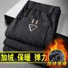 Venta directa de fábrica pantalones casuales para hombre invierno más terciopelo gruesos de pana pantalones de pana para hombre mediana edad sueltos pierna recta pantalones de pana