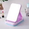 Espelho de maquiagem 3D de plástico de cor sólida, espelho de toucador 3D portátil, espelho pequeno dobrável de alta definição para mesa de dormitório de estudante