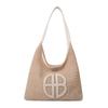 Bolsa de design vazado nicho para mulheres 2024 nova moda bolsa de ombro de palha versátil bolsa de palha trançada para axila