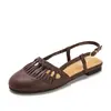 Sandalias de estilo retro para mujer, punta redonda, con borlas, para verano, suela plana, suaves, caladas, transpirables, con tira en T, zapatos de un solo color versátiles, modelo 1003-2