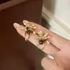 Nuevos Pendientes de Ojo de Tigre con Fuegos Artificiales Dorados Moda Minimalista Versátil Europea y Americana de Nicho Accesorios para Pendientes de Nicho
