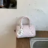 Bolso de mano de moda bolso tote pequeño para mujer 2026 Primavera nuevo bolsa almohada de lunares textura de nicho bolso de un solo hombro cruzado