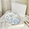 Atacado transfronteiriço Dijia porcelana óssea Prato ocidental Série de Natal Azul sonho infinito Prato com xícara Lucky Star Tigela Colher Talheres