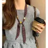 Collar de Bufanda de Seda con Perlas de Lunares Retro para Mujer 2026 Nueva Llegada Diseño de Nicho Cadena para Colgar en el Cuello de Suéter Capa Exterior para Superponer