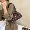 Bolso de axila retro de nicho para mujer, nuevo estilo 2026, gran capacidad, diseño de lunares, bolso de hombro versátil para ir al trabajo, estilo bolso de bolos