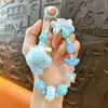 Llavero de cadena para teléfono con pompones y cuentas transfronterizo, colgante lindo para bolso, llavero de coche, regalo pequeño, venta al por mayor de comercio exterior