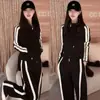 Conjunto de Ropa Deportiva para Mujer Otoño 2026: Sudadera con capucha y pantalones de pierna ancha adelgazantes de alta gama, conjunto casual de dos piezas para primavera