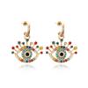 Pendientes de aleación con forma de ojo de diamante y personalidad europea y americana, exagerados pendientes de perla de ojo de diablo, joyería de oreja de diamante de color retro para mujer