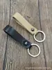 Llavero de coche de cuero genuino para hombres y mujeres, llavero retro con cuerda de cuero anti-pérdida, llavero creativo, llavero popular europeo y americano, regalo