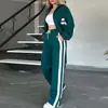 Ropa de mujer transfronteriza europea y americana 2026: Conjunto de dos piezas de moda de otoño, top a rayas y chaqueta, ropa deportiva casual para mujer