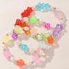 Pulsera nueva para niños transfronteriza, color caramelo, resina, oso transparente, dados, accesorios de flor pequeña, hecha a mano con cuentas para mujer