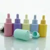 Botella cuentagotas de vidrio con cabeza de silicona color macarrón botella de muestra para viaje subempaque botella cosmética vacía botella para líquidos botella de esencia