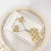 Nuevo especial transfronterizo explosión de tendencia europea y americana titanio acero alta calidad color collar pendientes traje femenino joyería de concha real