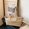 Bolso Tote de Cuero Suave Tipo Grano de Gran Capacidad Simple 2026 Nueva Moda de Primavera Bolso de Hombro Versátil para el Trabajo Bolso de Mujer