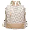 Venta al por mayor para comercio exterior: Mochila anti-robo de cuero suave para mujer estilo coreano 2026, bolsa de doble uso para viajes al aire libre con bloques de color de moda