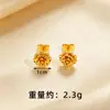 Aretes de flor dorados al por mayor lujo ligero sensación de alta gama aretes largos de borla de perla dorada para mujer alta retención de color joyería para orejas de Año Nuevo