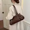 Bolso Coreano de Nicho Plegado con Remaches para Mujer 2026 Nuevo Estilo Estilo Motociclista Retro Bolso de Axila Sensación de Alta Gama Bolso de Hombro