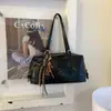 Bolsa de Ombro Retro Simples para Mulheres 2026 Outono Nova Grande Capacidade Elegante para Roupas de Trabalho Versátil Bolsa Tote de Ombro