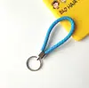 Llavero creativo llavero de cuerda de cuero cordón para llaves colgante de joyería cordón tejido fábrica de cuerda de cuero venta al por mayor