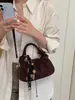 Exquisito bolso retro de gamuza de nicho para mujer, nuevo modelo 2026, bolso cruzado casual versátil, bolso de mano pequeño súper popular