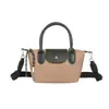 Nuevo bolso mini de patchwork de nailon de alta gama 2026 para mujer, bolso de mano de hombro cruzado moderno y versátil, bolsa de regalo