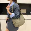 2025 Bolso de Hombro Nuevo Bolso Dumpling Estilo Deportivo para Mujer Japonés Simple Gran Capacidad Versátil Bolso Cruzado de Nylon